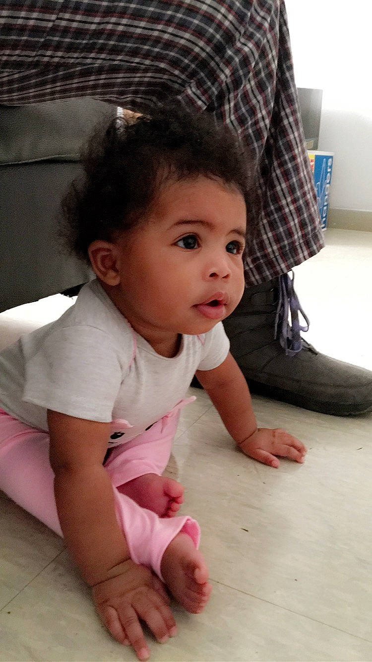 Malaysia is registered to the contest to win money with this photo: baby, baby_toddler_clothing, beauty, black_hair, cheek, child, crawling, floor, flooring, leg, nose, person, pink, sitting, skin, smile, toddler