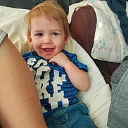 Draven joined the competition — help win amazing prizes! toddler, child, smiling, happy, blue_shirt, jeans, indoor, casual, portrait, person, light_hair, face, sitting, home, couch, blanket, fabric, comfort, relaxed, cute
