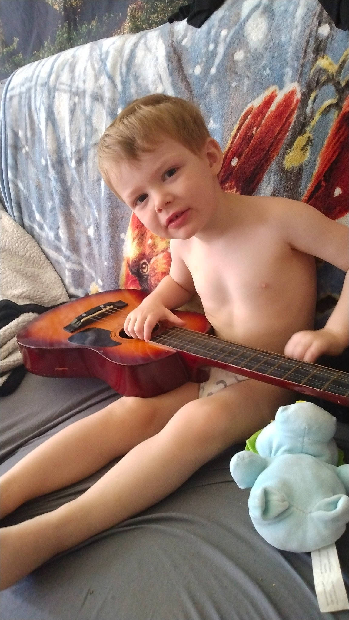 Bradlie joined the competition — help win amazing prizes! arm, child, finger, fun, guitar, guitar_accessory, happy, human, leg, musical_instrument, musical_instrument_accessory, person, plucked_string_instruments, sitting, smile, string_instrument, string_instrument_accessory, thigh, thumb, toddler