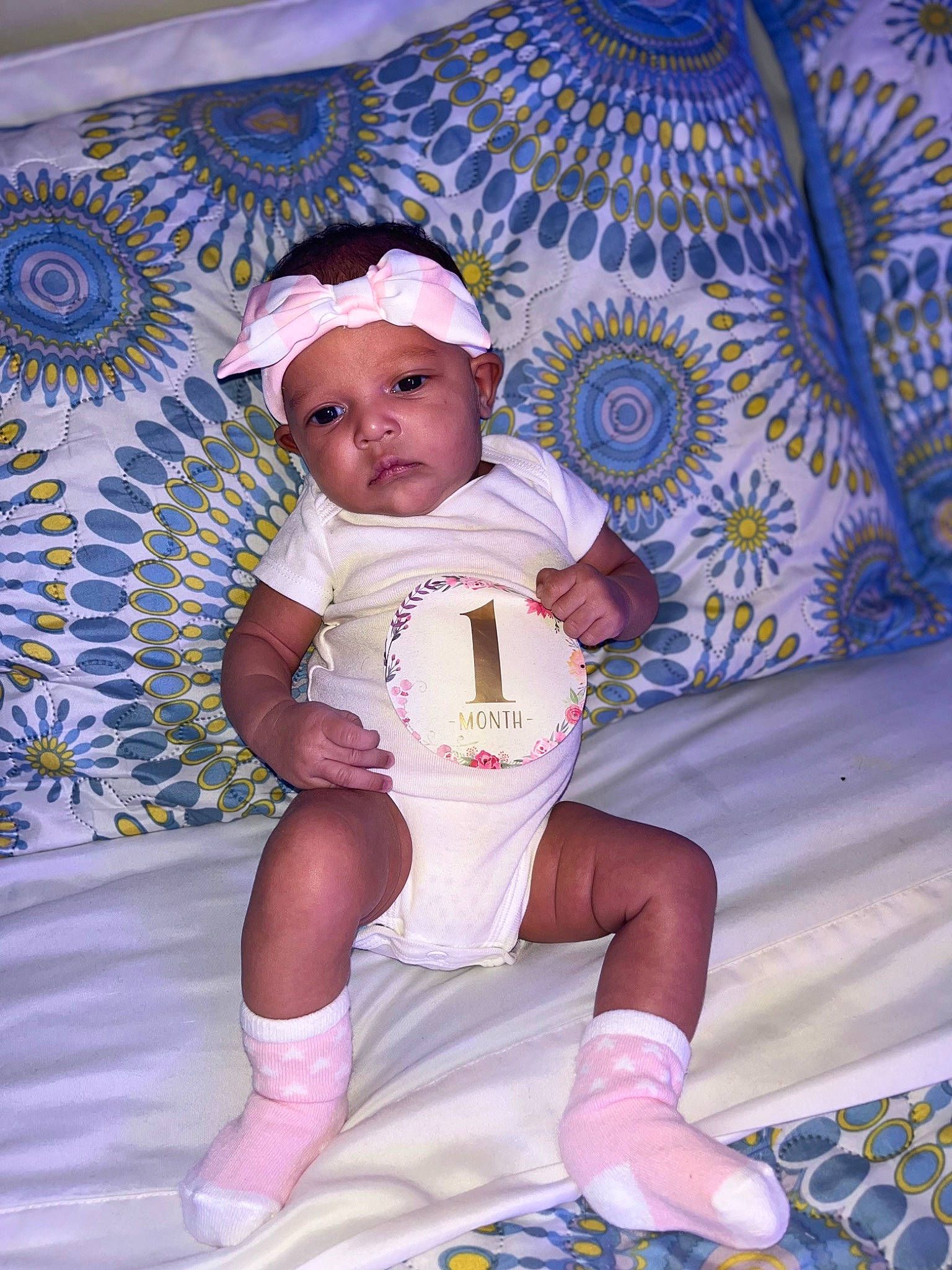 Maelani is registered to the contest to win money with this photo: abdomen, baby, baby_toddler_clothing, blue, child, fun, happy, hat, headwear, human_leg, knee, lap, person, pink, purple, skin, sock, sun_hat, textile, thigh