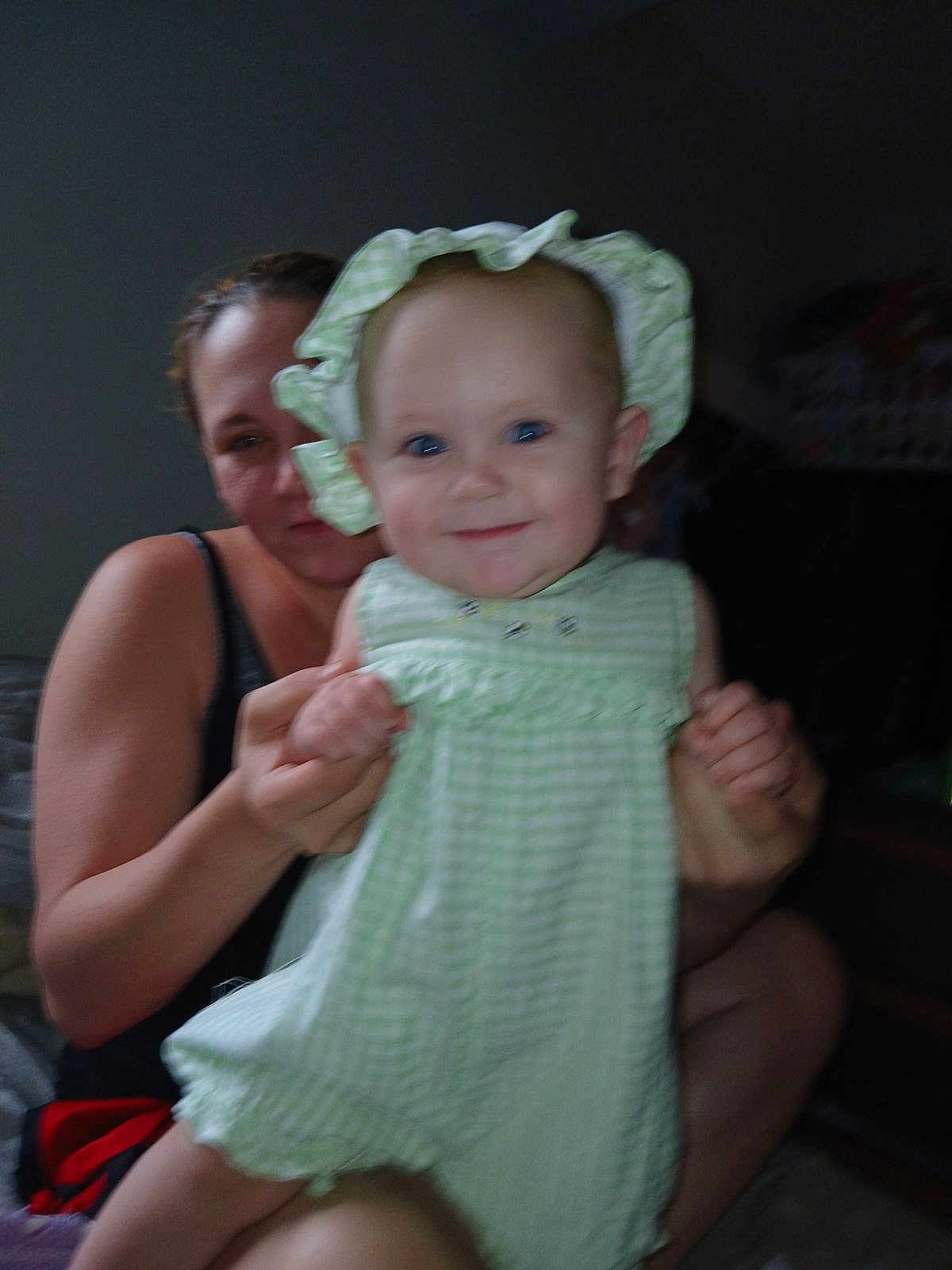 Journey is registered to the contest to win money with this photo: baby, blouse, bodypart, bonnet, cap, clothing, costume, dress, face, finger, happy, hat, head, laughing, person, photography, portrait, sitting, smile, swimwear