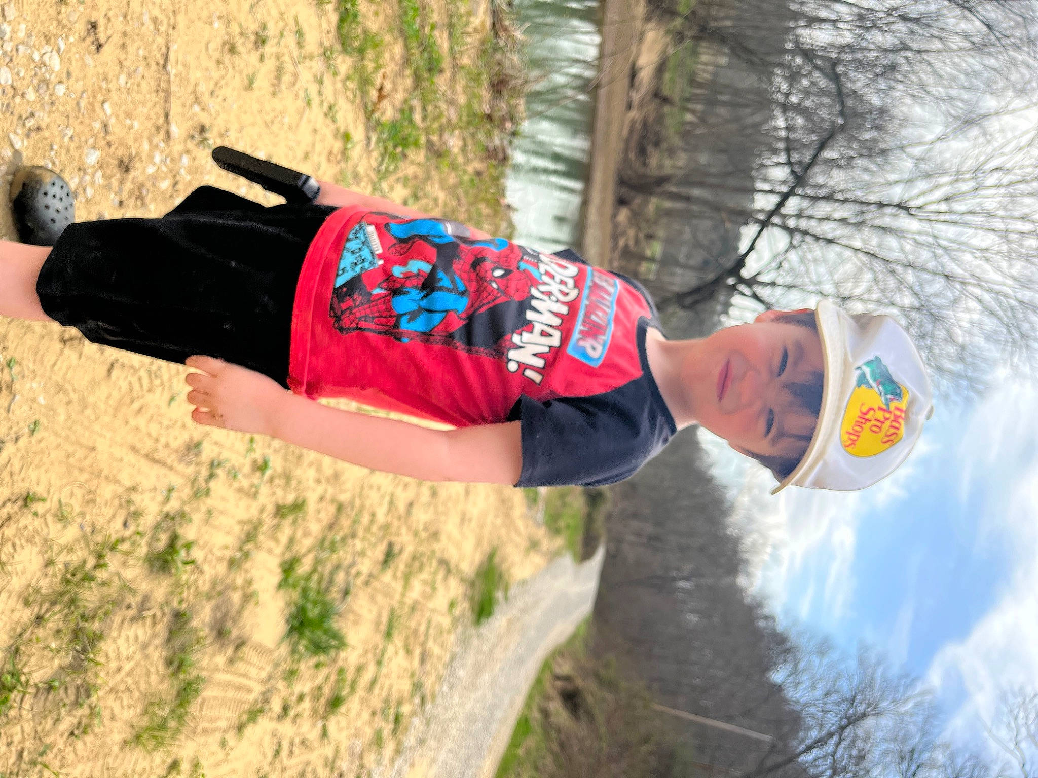 Brison is registered to the contest to win money with this photo: electric_blue, fun, grass, headwear, human_leg, leisure, people_in_nature, person, recreation, running, soil, sportswear, street_fashion, t_shirt, thigh, tree, waist, winter