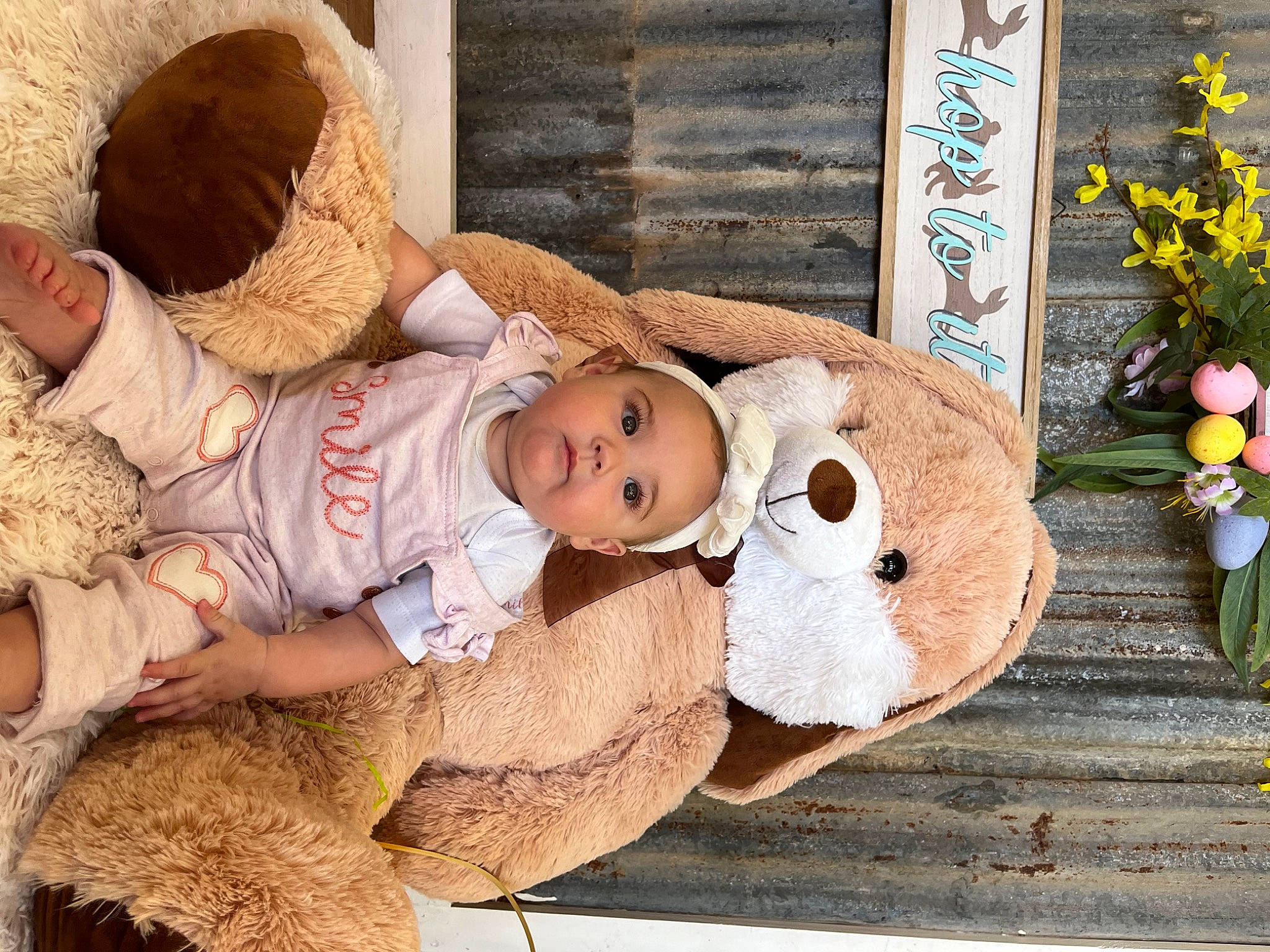 Kinsley is registered to the contest to win money with this photo: baby, baby_sleeping, baby_toddler_clothing, child, comfort, doll, door, eye, fur, happy, hat, headgear, person, room, sitting, stuffed_toy, textile, toddler, toy, wood