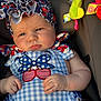 Catalina joined the competition — help win amazing prizes! baby, child, infant, car_seat, headband, clothing, blue, red, white, stars, cherries, pattern, toy, sunlight, portrait, cute, chubby_cheeks, serious_expression, indoor, seatbelt