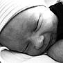 Noah is registered to the contest to win money with this photo: arm, baby, baby_sleeping, bedtime, cheek, chin, comfort, eyebrow, finger, gesture, hand, happy, monochrome, monochrome_photography, mouth, nose, skin, smile, toddler, white