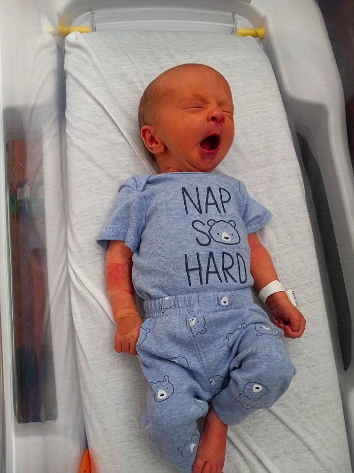 Noah joined the competition — help win amazing prizes! baby, baby_products, baby_toddler_clothing, child, comfort, denim, electric_blue, facial_expression, finger, hairstyle, infant_bed, joint, mouth, person, product, sitting, skin, sleeve, t_shirt, textile