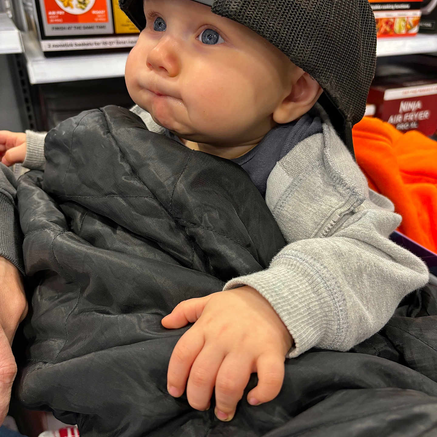 Mavrik is registered to the contest to win money with this photo: baby, baseballcap, beanie, bodypart, bonnet, box, cap, clothing, coat, face, finger, hand, hat, head, hood, jacket, pants, person, photography, portrait