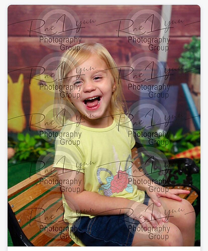 Olivia joined the competition — help win amazing prizes! advertising, beauty, blond, child, facial_expression, font, grass, hairstyle, happy, logo, magenta, pattern, person, photo_caption, product, smile, snapshot, stock_photography, t_shirt, toddler