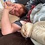 adult, animal, baby, blanket, cat, couch, cushion, face, furniture, head, homedecor, indoors, kitten, male, man, person, pet, photography, portrait, sleeping
