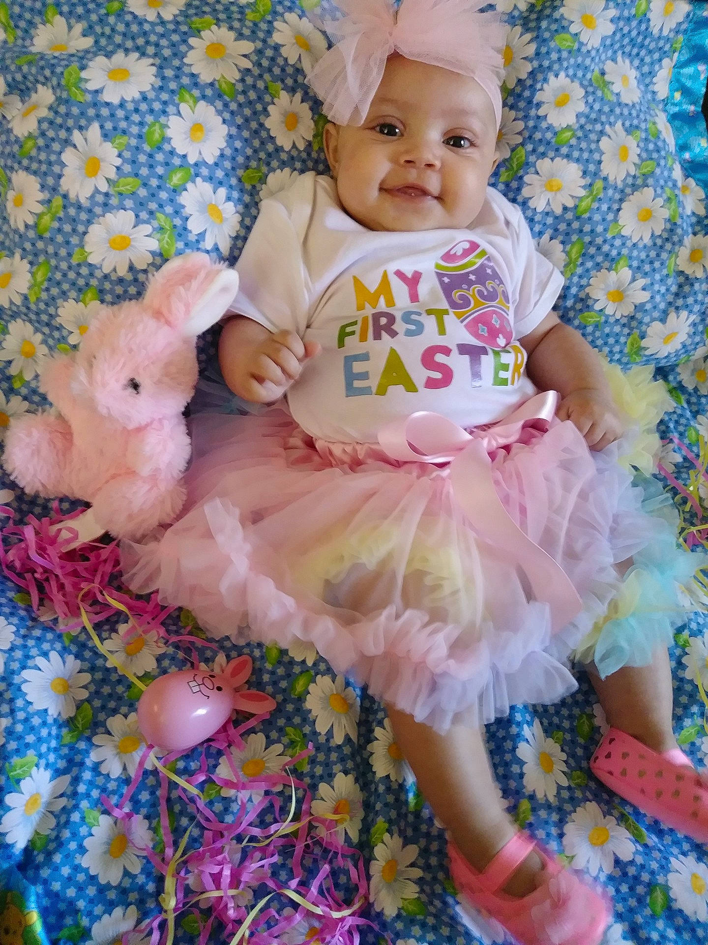 Mo'Nae is registered to the contest to win money with this photo: baby_products, child, dance_dress, day, girl, hair_accessory, human_hair_color, infant, iris, material, person, petal, pink, play, product, purple, skin, textile, toddler, toy