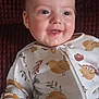 Trenton joined the competition — help win amazing prizes! baby, child, smiling, onesie, clothing, pattern, chick, animal_print, drool, face, head, person, sitting, cute, infant, indoors, texture, background, happy, young
