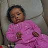 Brooklynne joined the competition — help win amazing prizes! baby, car_interior, car_seat, casual, child, clothing, curly_hair, cute, face, indoor, infant, infant_clothing, looking_at_camera, person, pink_onesie, portrait, relaxed, seat, seatbelt, young_child