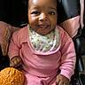 Brooklynne joined the competition — help win amazing prizes! baby, bib, bright_eyes, car_seat, child, cozy, cute, face, hand, happy, indoors, infant, orange_ball, pink_clothing, playful, portrait, sitting, smile, toy, young_child