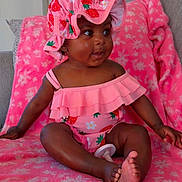 Jream joined the competition — help win amazing prizes! baby, infant, child, pink, blanket, hat, strawberry_pattern, clothing, sitting, cute, smiling, indoors, soft_texture, portrait, happy, face, foot, hand, comfortable, cozy