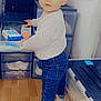 Thiméo a rejoint le concours — aidez-le/la à gagner de superbes lots ! child, clothing, curious, drawer, face, floor, hair, home, indoor, jeans, person, plastic_container, room, standing, storage_box, sweater, toddler, toy_box, white_sneakers, wooden_floor