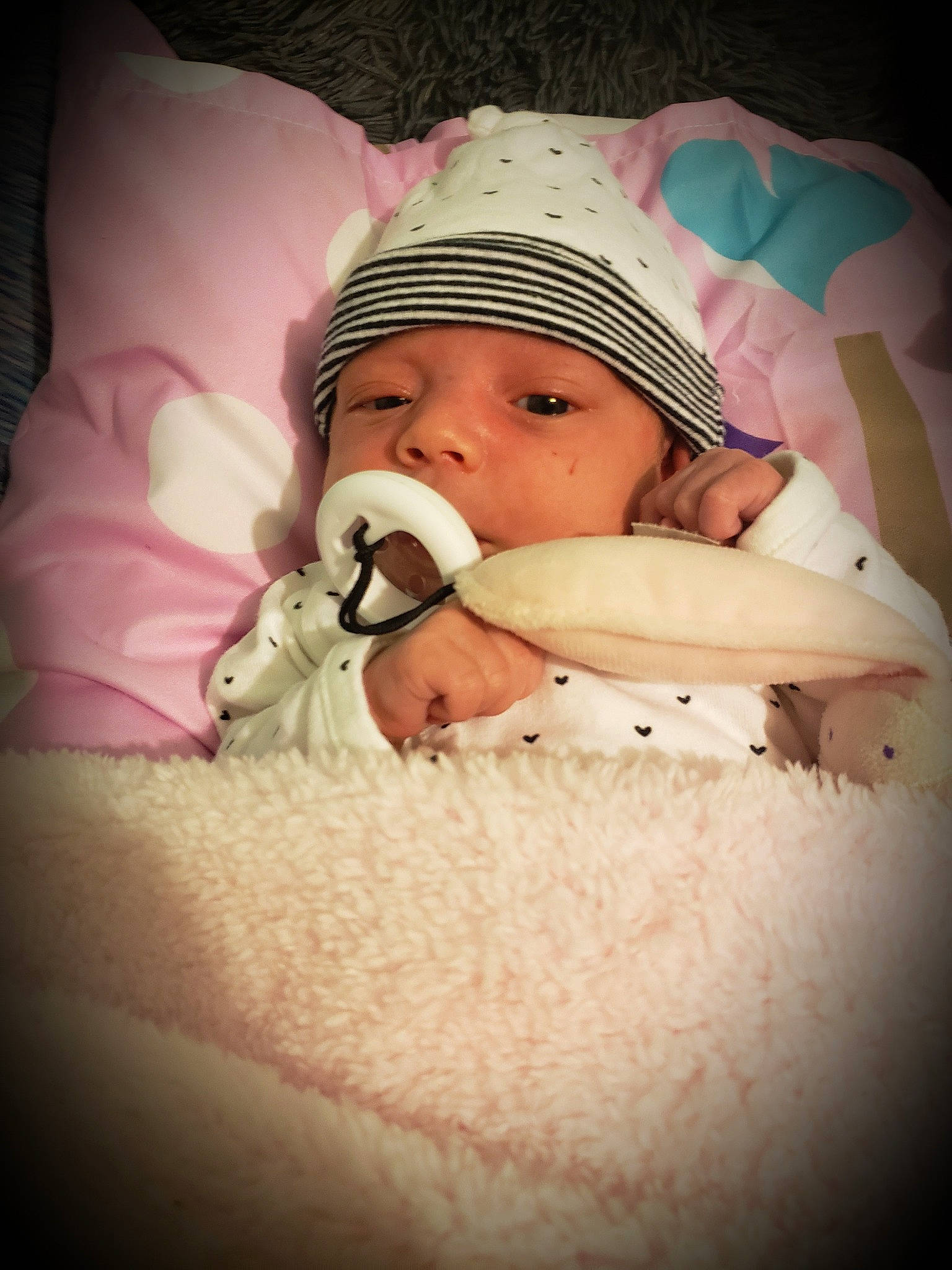 Gia joined the competition — help win amazing prizes! baby, baby_products, baby_sleeping, baby_toddler_clothing, bedtime, cap, cheek, comfort, eyelash, finger, flash_photography, happy, headgear, headwear, human_body, linens, lip, mouth, person, pink