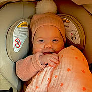 Angelina Terracciano is registered to the contest to win money with this photo: baby, beanie, blanket, candid, car_seat, child, close_up, cozy, fabric, hand, heart_pattern, infant, nasal_cannula, oxygen_tubing, pink, pompom, portrait, seat_padding, smile, warning_label