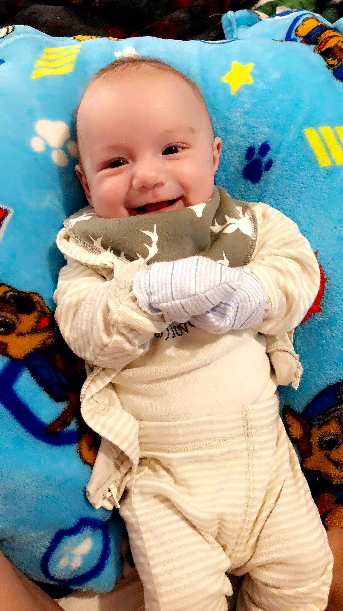 Kaleb is registered to the contest to win money with this photo: baby, baby_laughing, baby_toddler_clothing, blue, cheek, child, facial_expression, fictional_character, fun, gesture, happy, head, joy, linens, person, photograph, pink, sleeve, smile, textile