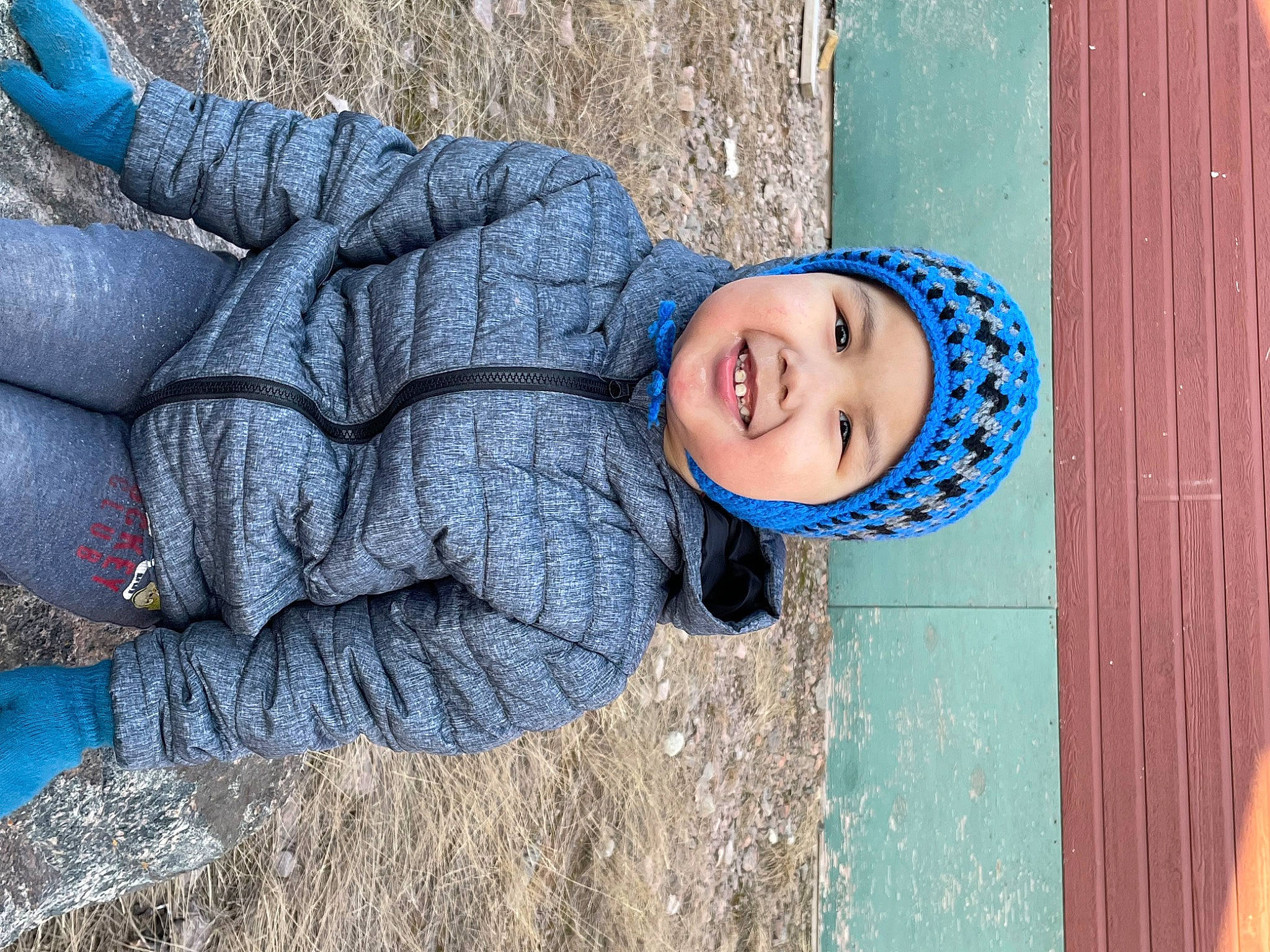 Desmond joined the competition — help win amazing prizes! azure, blue, child, denim, electric_blue, fashion_accessory, fun, grass, happy, hat, headgear, headwear, joy, leisure, person, plant, sitting, smile, toddler, tree