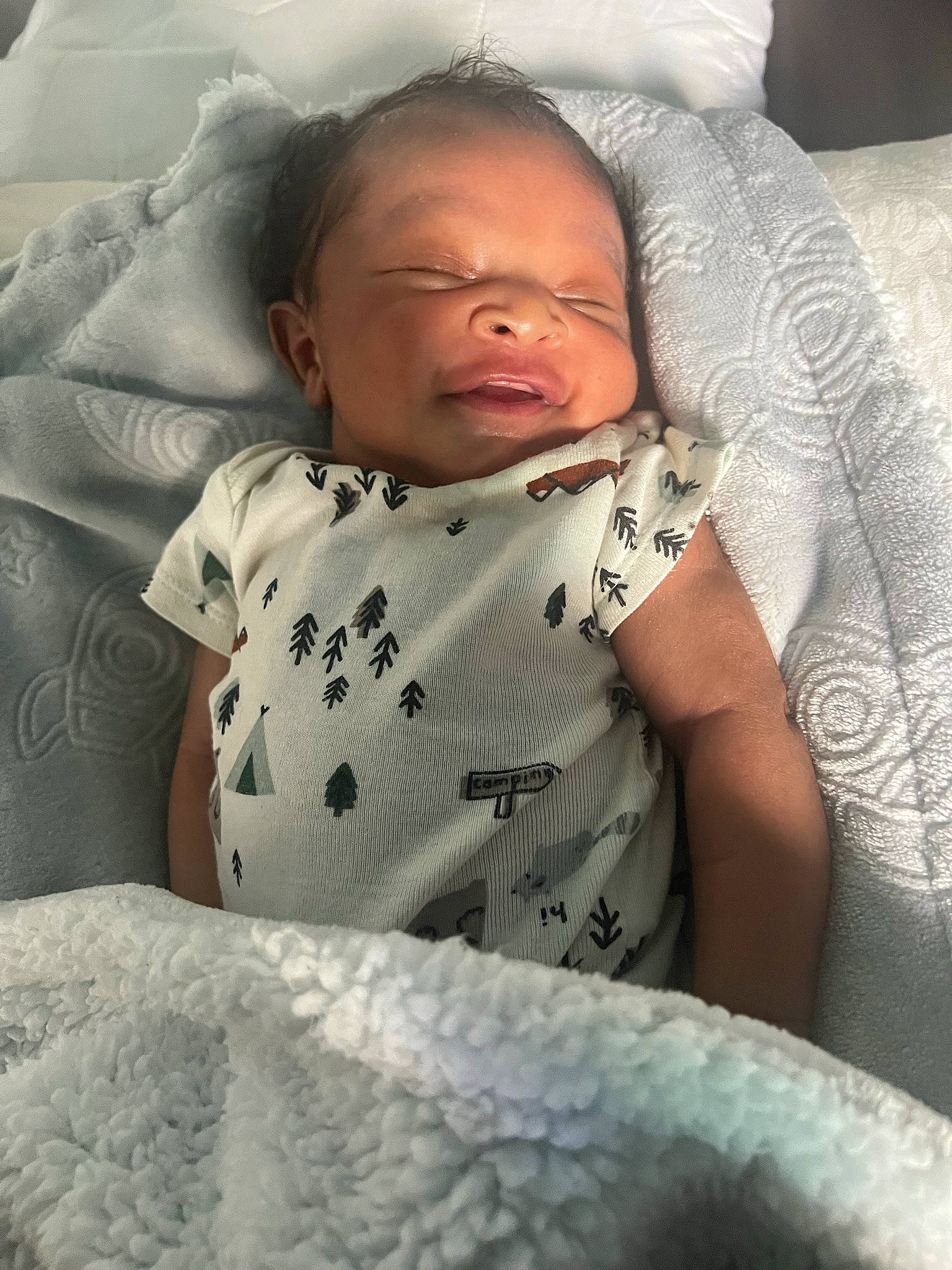 Giovanni is registered to the contest to win money with this photo: arm, baby, baby_sleeping, beard, bed, bed_sheet, bedding, bedtime, child, comfort, face, grey, linens, mouth, person, sitting, skin, sleeve, t_shirt, textile