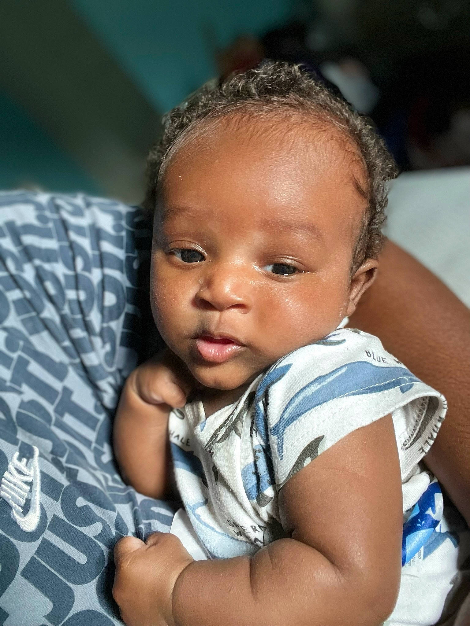 Giovanni is registered to the contest to win money with this photo: arm, baby, black_hair, cheek, child, chin, close_up, comfort, elbow, flash_photography, fun, hand, happy, iris, nose, person, sitting, skin, smile, toddler