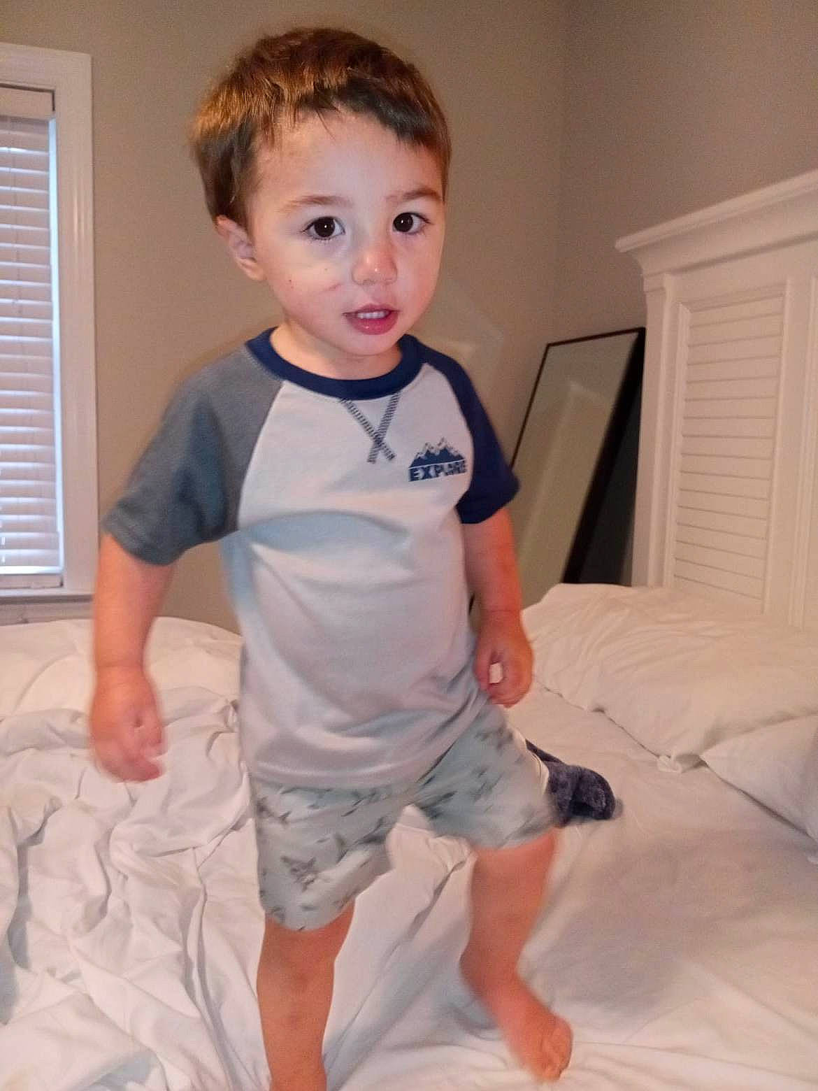 Kash is registered to the contest to win money with this photo: baby_toddler_clothing, child, comfort, elbow, flooring, fun, happy, human_leg, joint, knee, muscle, person, room, shoulder, sitting, sleeve, t_shirt, toddler, trunk, window