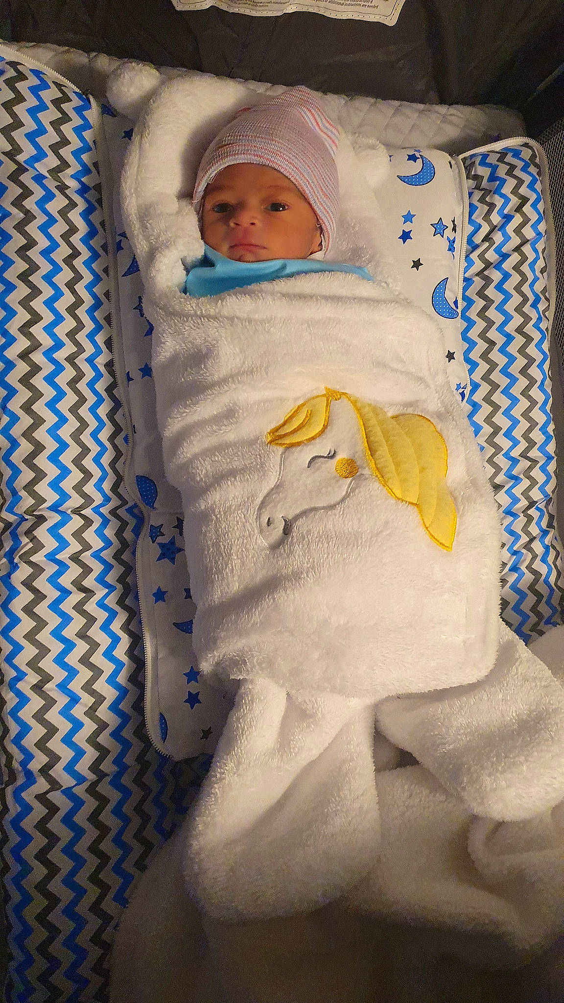 Amogh is registered to the contest to win money with this photo: baby, baby_products, baby_safety, baby_sleeping, baby_toddler_clothing, bed_sheet, bedding, bedtime, blanket, child, comfort, hat, headwear, infant_bed, linens, pattern, person, room, sleeve, toddler