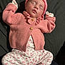newborn, baby, sleeping, pink, knitwear, hat, sweater, floral, pants, socks, infant, cute, peaceful, lying_down, child, portrait, soft, warm, cozy, indoors