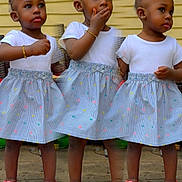 Jaior Milani is registered to the contest to win money with this photo: toddler, child, girl, multiple_poses, collage, white_top, striped_skirt, pink_sandals, pink_hair_ties, braided_hair, standing, wooden_floor, yellow_wall, bracelet, earrings, outdoor, portrait, cute, fashion, expression