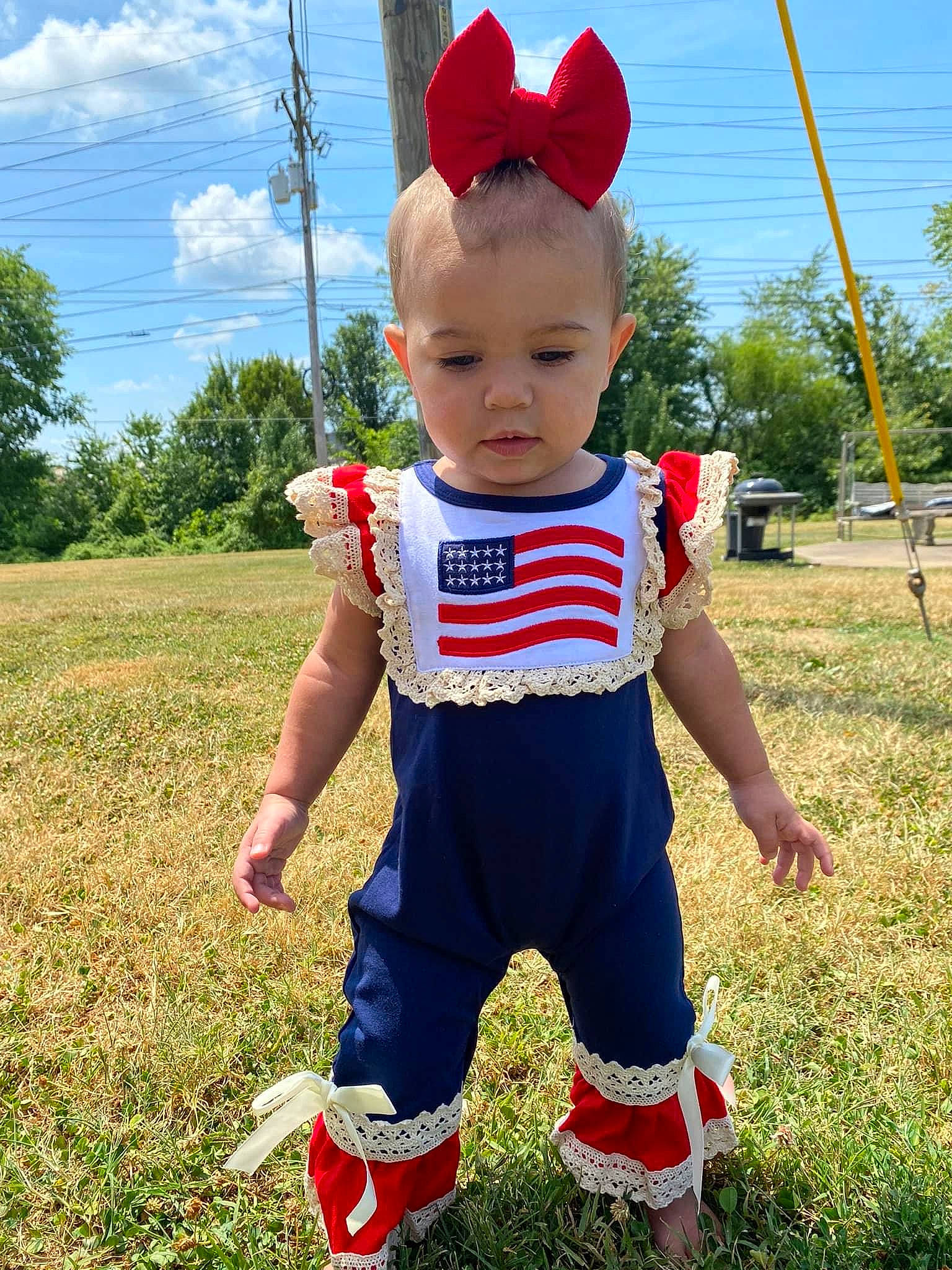 Kenleigh Grace is registered to the contest to win money with this photo: baby, baby_toddler_clothing, child, cloud, electric_blue, fun, grass, grassland, happy, hat, leisure, people_in_nature, person, personal_protective_equipment, plant, play, recreation, sky, t_shirt, toddler