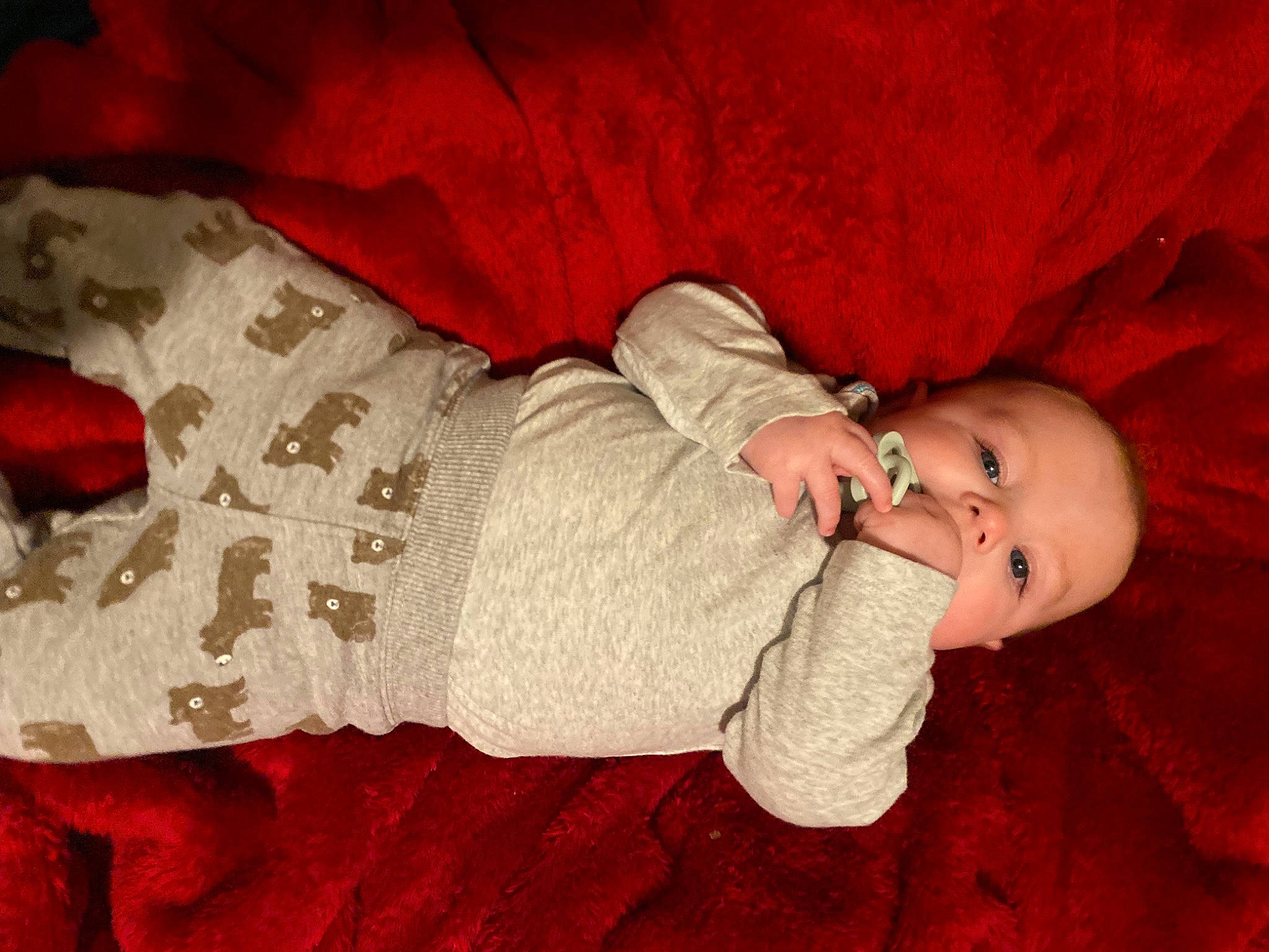 Westyn is registered to the contest to win money with this photo: baby, baby_toddler_clothing, cheek, child, clothing, comfort, finger, flooring, hand, headgear, human_body, orange, organ, outerwear, person, red, skin, sleeve, textile, toddler