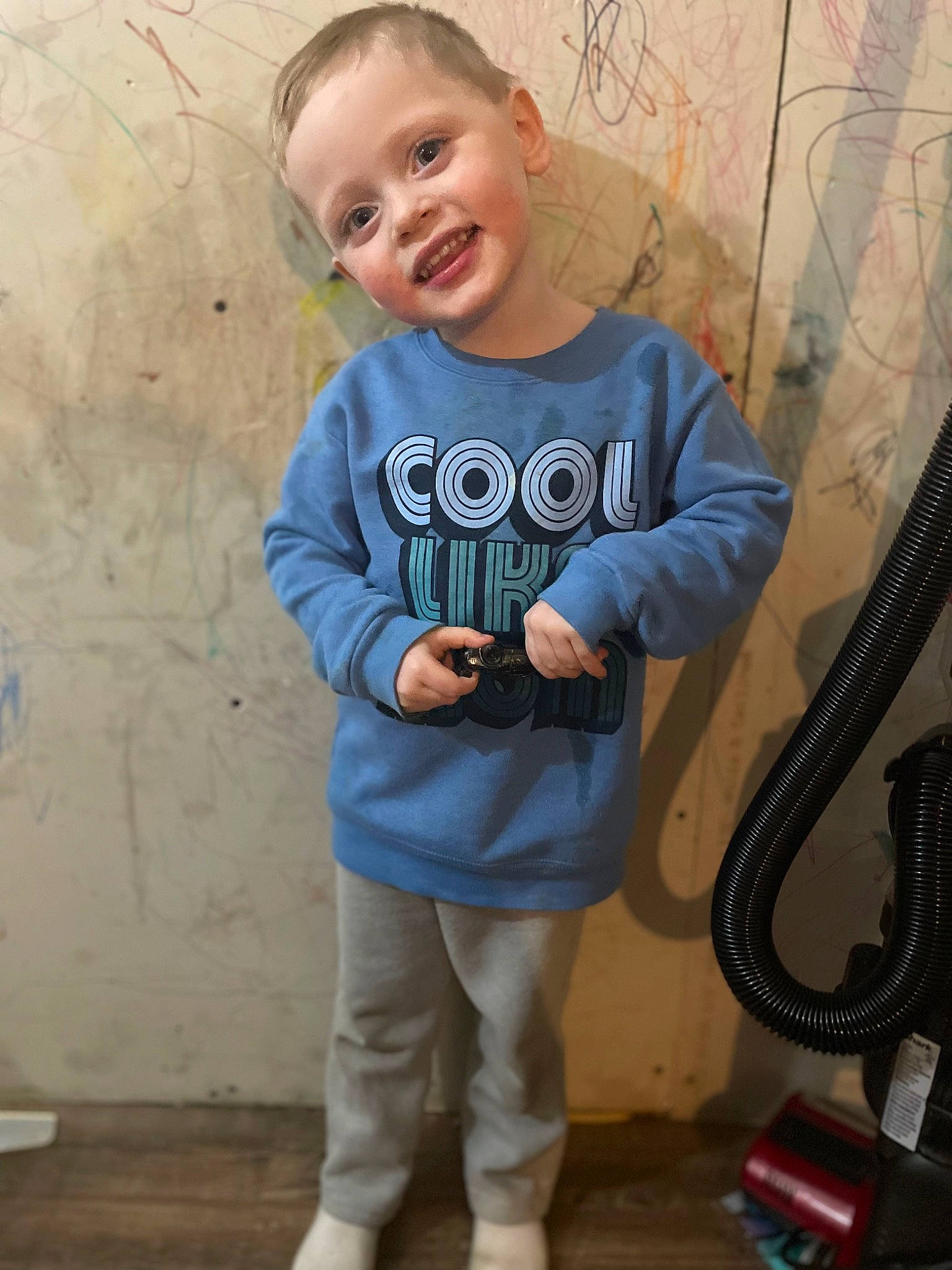 Kayden is registered to the contest to win money with this photo: baby, baby_toddler_clothing, child, cool, denim, electric_blue, grey, hairstyle, happy, head, pattern, person, shoulder, sleeve, smile, sportswear, standing, street_fashion, t_shirt, toddler