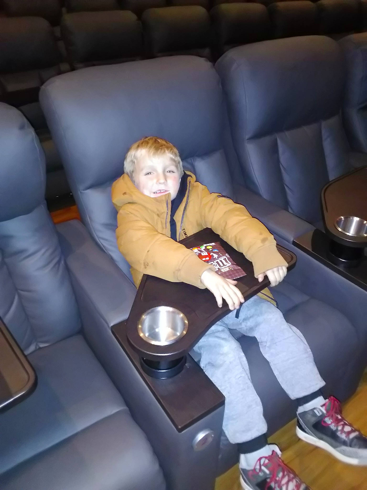 Dudley is registered to the contest to win money with this photo: armrest, auto_part, car_seat, comfort, couch, furniture, lap, person, sitting