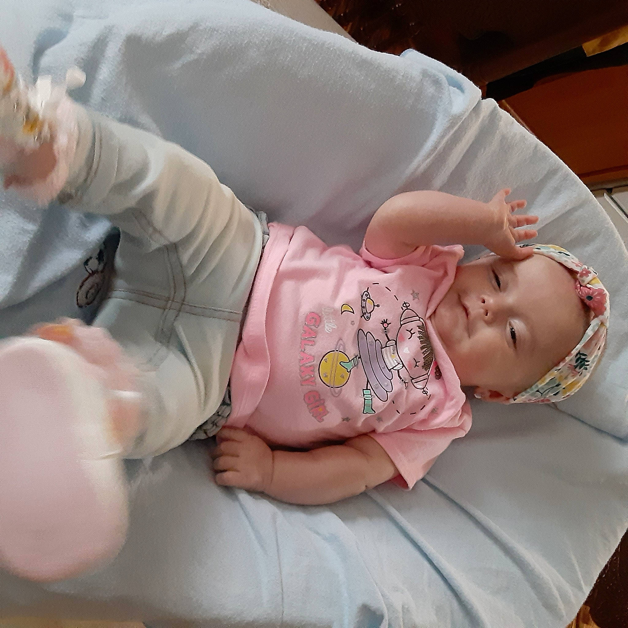 Lorelei is registered to the contest to win money with this photo: baby, baby_products, baby_sleeping, baby_toddler_clothing, cheek, child, comfort, finger, foot, gesture, linens, nail, person, pink, product, sitting, skin, sleep, sleeve, thumb