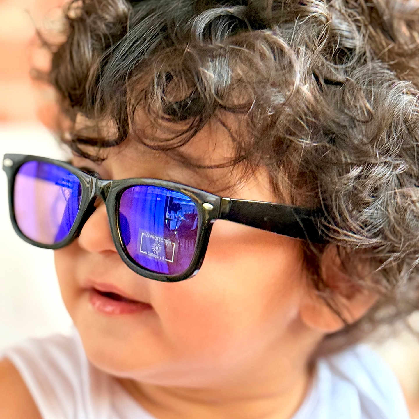 Shahrukh is registered to the contest to win money with this photo: accessories, blonde, bodypart, child, face, female, finger, girl, glasses, goggles, hair, hand, happy, head, person, photography, portrait, smile, sphere, sunglasses