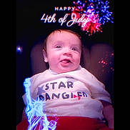 Walker joined the competition — help win amazing prizes! baby, child, smiling, tshirt, text_overlay, fireworks, statue_of_liberty, 4th_of_july, celebration, holiday, portrait, sitting, happy, indoors, red, white, blue, digital_art, glow, festive