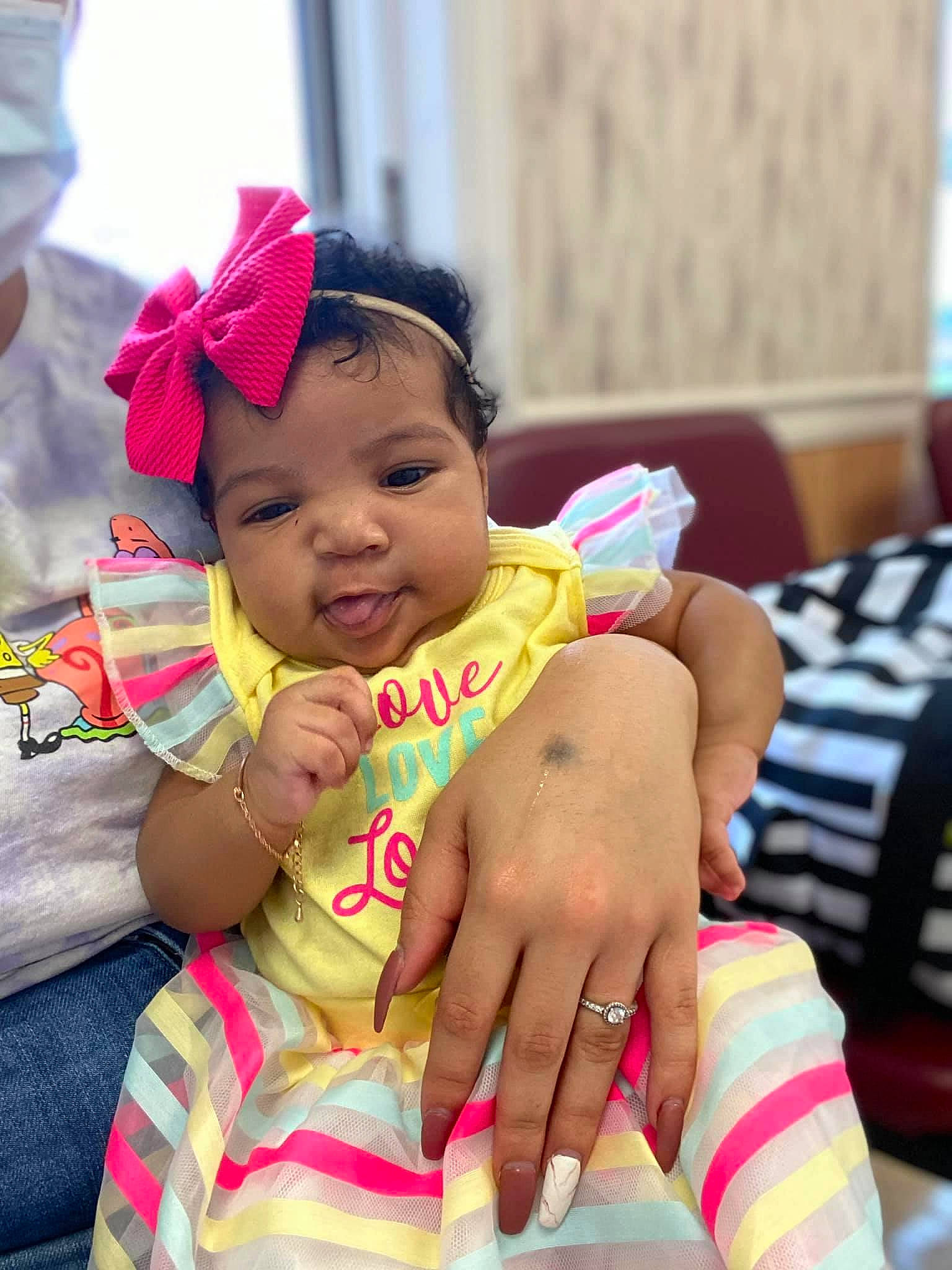 Zahra is registered to the contest to win money with this photo: adaptation, baby, cheek, child, face, finger, fun, hand, happy, head, headgear, human, neck, people, person, pink, sitting, skin, smile, toddler