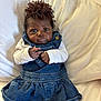 baby, infant, denim_dress, headband, flower_headband, white_shirt, pillow, cute, portrait, child, clothing, face, skin, hands, eyes, indoor, person, lying_down, soft, adorable