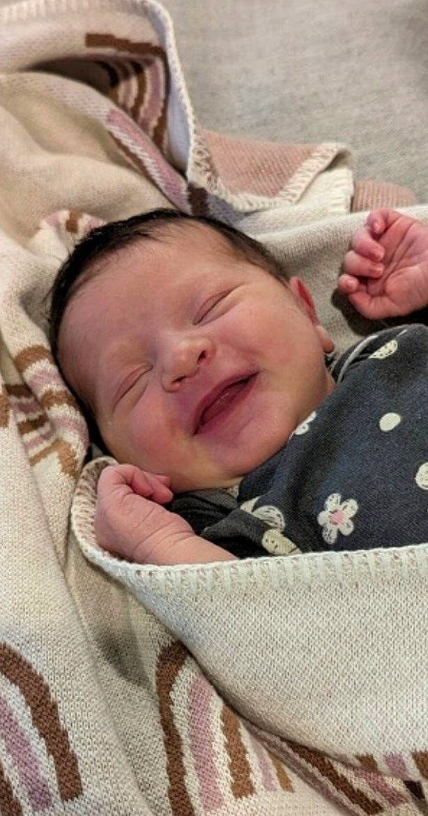 Erin is registered to the contest to win money with this photo: baby, bedding, bedtime, cheek, child, comfort, gesture, happy, laugh, linens, nap, pattern, person, skin, sleep, smile, textile, toddler, wrinkle