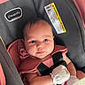 Leah joined the competition — help win amazing prizes! baby, car_seat, pink, mittens, infant, child, seatbelt, straps, clothing, face, head, person, closeup, indoor, sitting, cute, young, infancy, safety, portrait