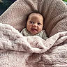 baby, blanket, cushion, smile, happy, face, infant, cozy, pink, texture, outdoor, grass, chair, seat, portrait, person, warm, comfort, clothing, cute