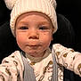 toddler, child, baby, hat, knit_hat, pom_poms, onesie, car_seat, seatbelt, cute, face, expression, indoor, warm_clothing, closeup, portrait, infant, childhood, safety, young