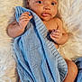 baby, infant, blanket, blue_blanket, knitted, soft_texture, fluffy, white_background, cute, skin, hand, foot, lying_down, portrait, newborn, child, face, eyes, fingers, warm