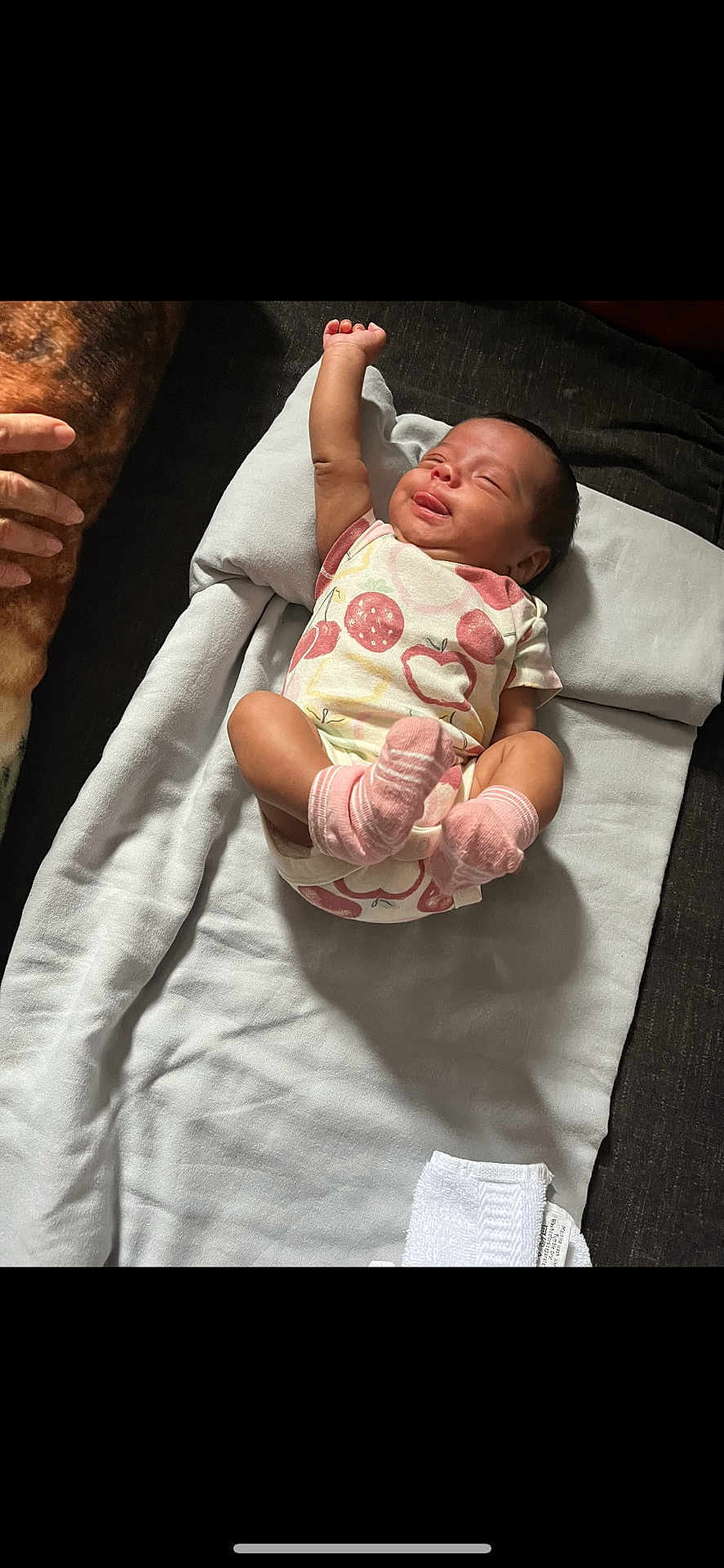Adeline joined the competition — help win amazing prizes! baby, infant, onesie, pink_socks, blanket, sleeping, tongue_out, raised_arm, hand, soft_fabric, laying_down, cute, newborn, child, comfortable, indoors, person, resting, peaceful, peaceful_expression