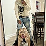 casual_clothing, chair, dog, flooring, furniture, harness, home, hoodie, indoor, jeans, light, man, mirror, pet, portrait, reflection, selfie, smartphone, table, tattoo
