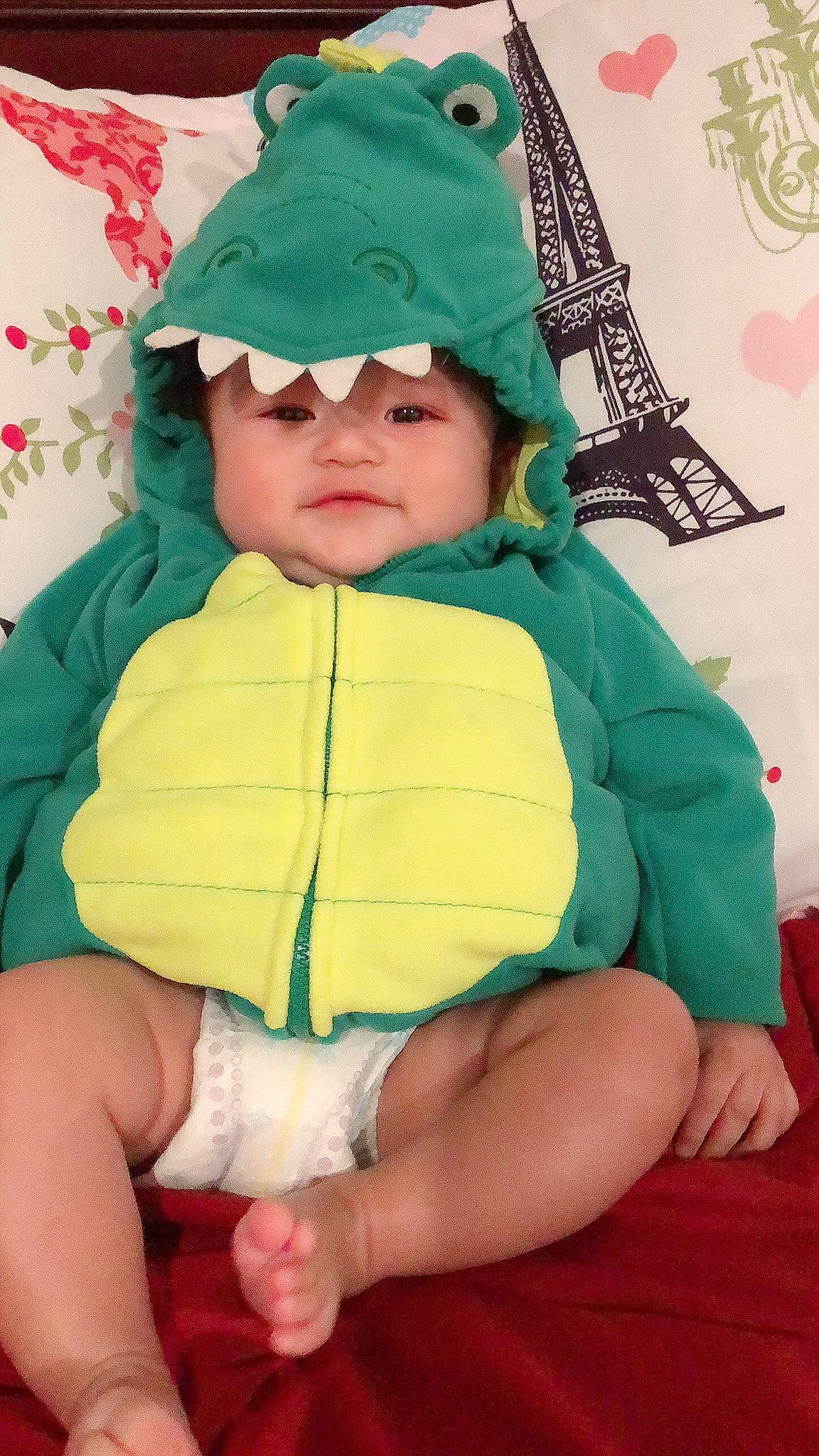 Bruce joined the competition — help win amazing prizes! baby, baby_products, baby_toddler_clothing, bonnet, child, comfort, costume, costume_accessory, costume_hat, fictional_character, green, headwear, hood, human, lap, nose, overall, person, sock, toddler