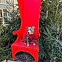 Magnum participe au concours pour gagner de l'argent avec cette photo : animal, canine, decorations, dog, festive, large_chair, leaves, nature, outdoor, park, pavement, pet_clothing, pine_trees, quiet, red_chair, seat, string_lights, tree, winter, wood