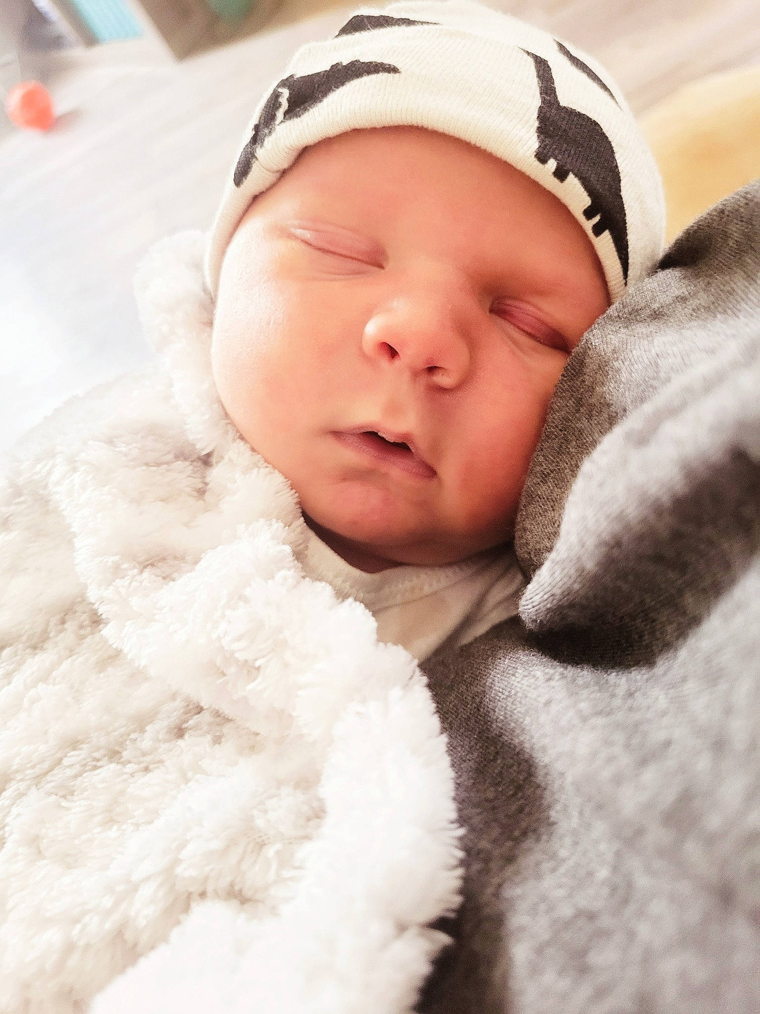 Gunner is registered to the contest to win money with this photo: baby, baby_sleeping, baby_toddler_clothing, beanie, bedtime, cap, cheek, child, comfort, fur, happy, headwear, knit_cap, linens, lip, nose, peach, person, portrait_photography, skin