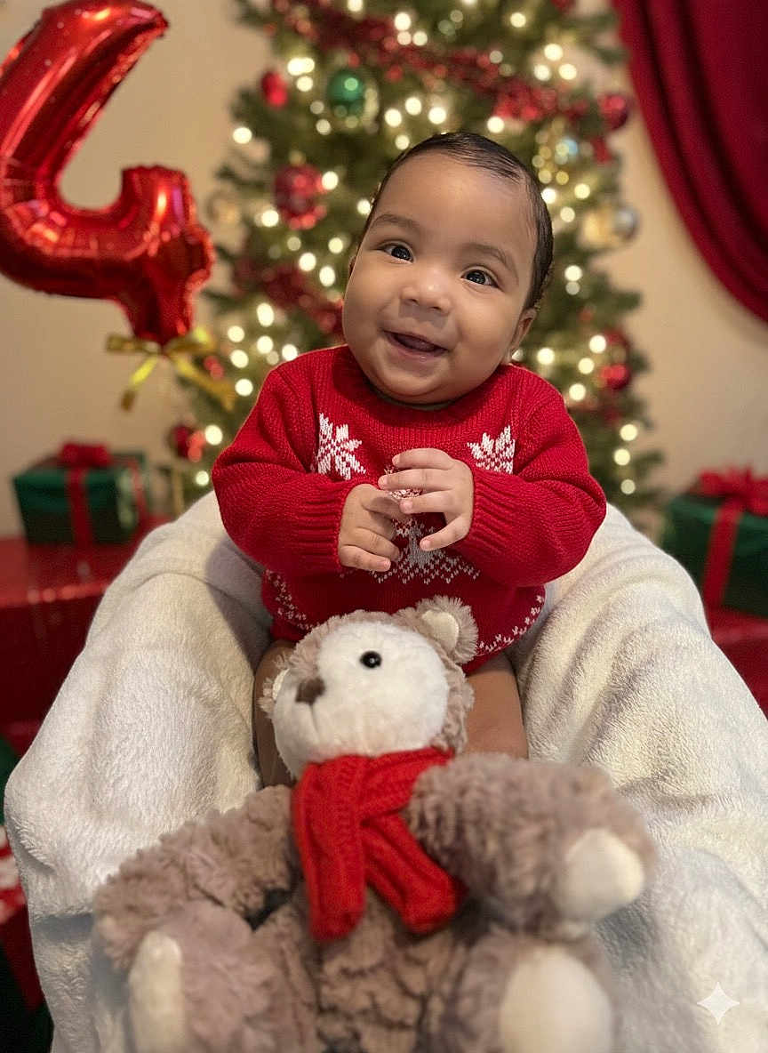 Yeshua joined the competition — help win amazing prizes! baby, child, smiling, red_sweater, teddy_bear, plush_toy, christmas_tree, holiday, decorations, balloon, gift_boxes, festive, indoors, happy, portrait, seasonal, cute, warm, celebration, joyful