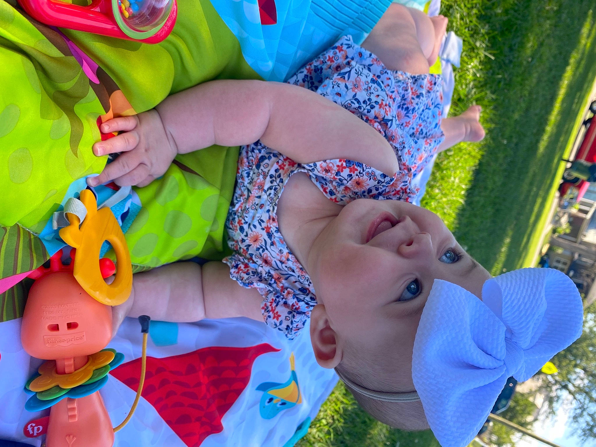 Braylee is registered to the contest to win money with this photo: blue, child, electric_blue, event, fun, grass, green, happy, hat, headwear, leisure, party_supply, person, pink, plant, recreation, smile, summer, textile, toddler